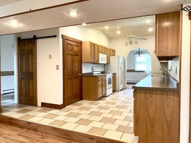 840 Lansberry Ct, Somerset Boro, PA 15501 - kitchen with white appliances, ceiling fan, dark countertops, a barn door, and a textured ceiling