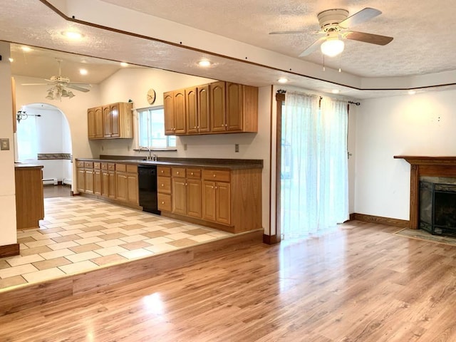 840 Lansberry Ct, Somerset Boro, PA 15501 - kitchen featuring a ceiling fan, a textured ceiling, dishwasher, dark countertops, and light wood-type flooring