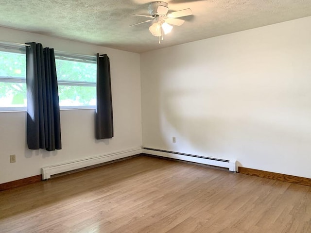 840 Lansberry Ct, Somerset Boro, PA 15501 - unfurnished room with wood finished floors, ceiling fan, a textured ceiling, a baseboard radiator, and a baseboard heating unit