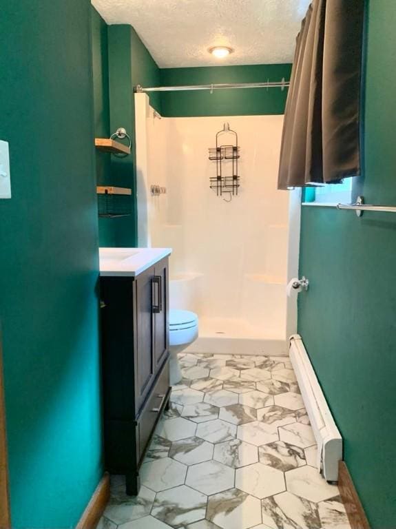 840 Lansberry Ct, Somerset Boro, PA 15501 - full bath featuring a shower, a textured ceiling, vanity, a baseboard heating unit, and marble look tiles