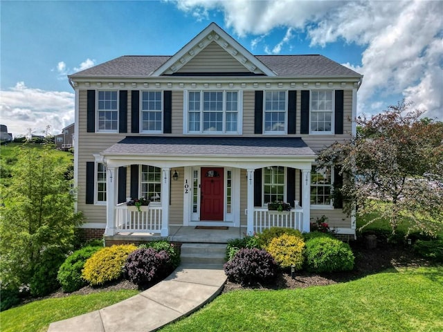 102 Bridal Ln, North Fayette, PA 15071 - view of front of house with covered porch, a front yard, and a shingled roof