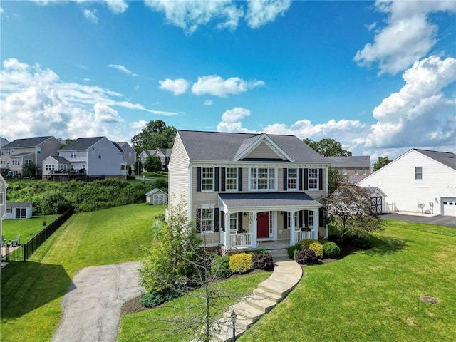 102 Bridal Ln, North Fayette, PA 15071 - colonial-style house featuring covered porch, a front yard, driveway, and a residential view