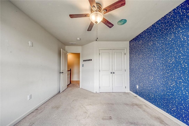 102 Bridal Ln, North Fayette, PA 15071 - unfurnished bedroom with carpet, wallpapered walls, a ceiling fan, and a closet