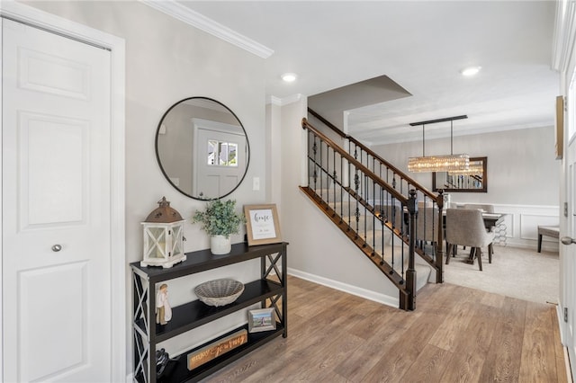 1026 Tee Line Dr, Hopewell Twp, PA 15001 - staircase featuring a chandelier, ornamental molding, wood finished floors, and recessed lighting