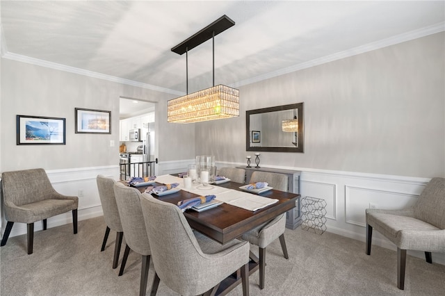 1026 Tee Line Dr, Hopewell Twp, PA 15001 - dining room with a chandelier, light colored carpet, ornamental molding, a wainscoted wall, and a decorative wall