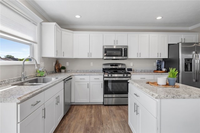 1026 Tee Line Dr, Hopewell Twp, PA 15001 - kitchen featuring appliances with stainless steel finishes, crown molding, white cabinets, wood finished floors, and recessed lighting