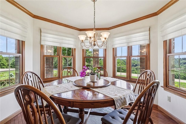 221 Scott Hollow Rd, Pa, PA 15021 - dining space featuring plenty of natural light, wood finished floors, a chandelier, and ornamental molding