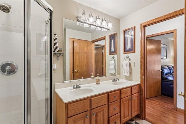 221 Scott Hollow Rd, Pa, PA 15021 - ensuite bathroom with a shower stall, double vanity, and wood finished floors