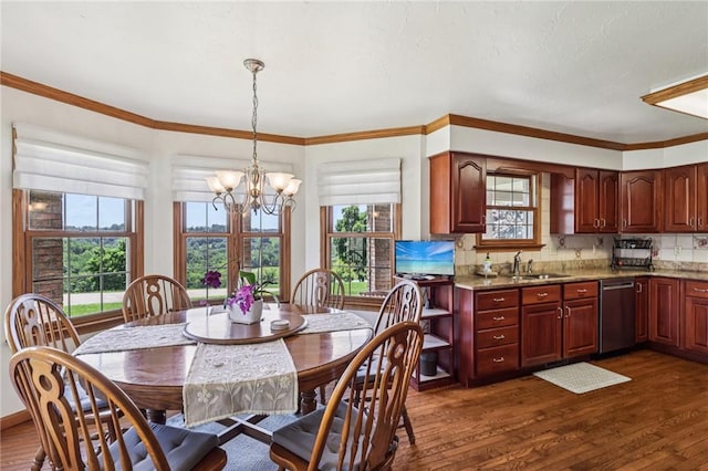 221 Scott Hollow Rd, Pa, PA 15021 - dining area with a chandelier, dark wood-style flooring, healthy amount of natural light, and ornamental molding