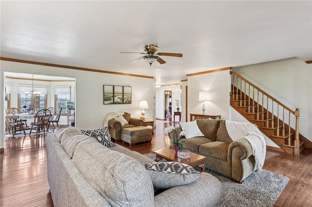 221 Scott Hollow Rd, Pa, PA 15021 - living room featuring stairs, a ceiling fan, wood-type flooring, a chandelier, and crown molding
