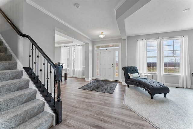 107 Valley View Dr, Brighton Twp, PA 15009 - foyer featuring stairway, ornamental molding, and wood finished floors