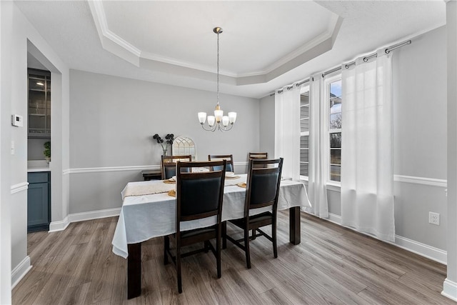 107 Valley View Dr, Brighton Twp, PA 15009 - dining space with a raised ceiling, wood finished floors, a chandelier, and crown molding