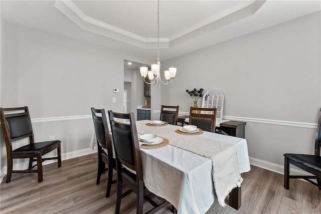107 Valley View Dr, Brighton Twp, PA 15009 - dining space featuring a raised ceiling, dark wood-style flooring, a chandelier, and crown molding