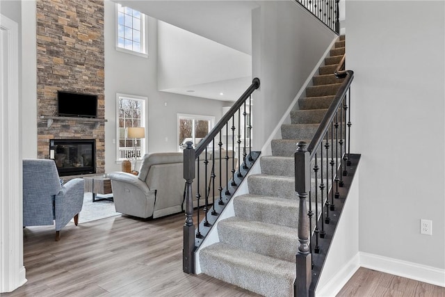 107 Valley View Dr, Brighton Twp, PA 15009 - stairs with a high ceiling, wood finished floors, and a stone fireplace