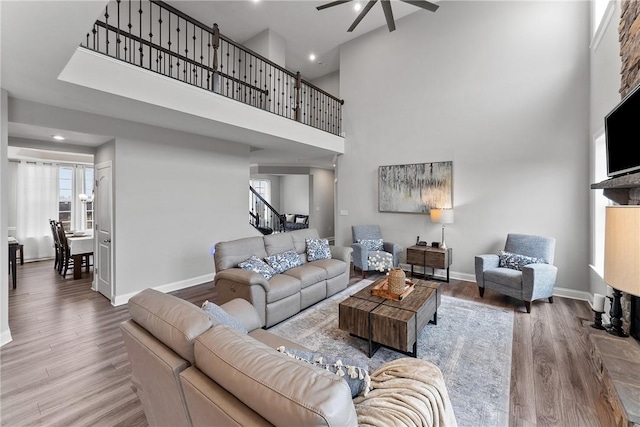 107 Valley View Dr, Brighton Twp, PA 15009 - living room with a ceiling fan, wood finished floors, stairs, a towering ceiling, and recessed lighting