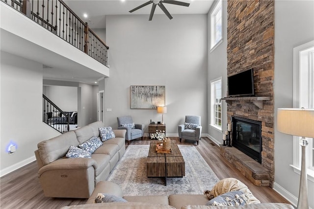 107 Valley View Dr, Brighton Twp, PA 15009 - living room with a fireplace, healthy amount of natural light, ceiling fan, a towering ceiling, and wood finished floors
