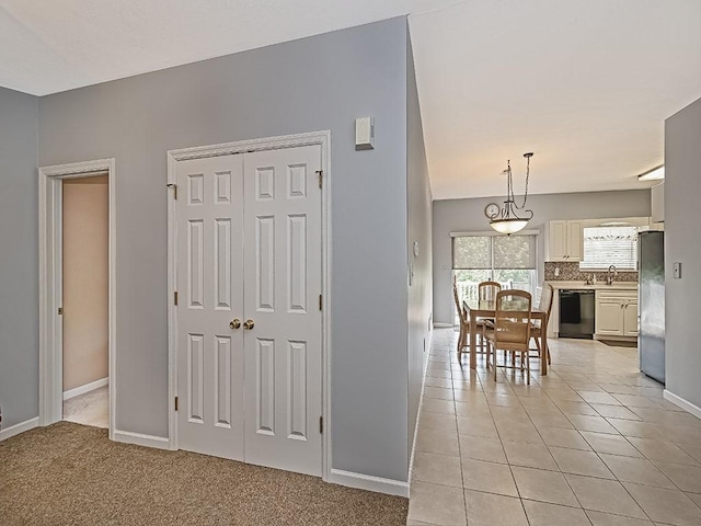 25 Elena Ave Unit 25, Lower Burrell, PA 15068 - hall with baseboards and light tile patterned floors