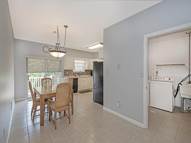 25 Elena Ave Unit 25, Lower Burrell, PA 15068 - dining area featuring light tile patterned floors and separate washer and dryer