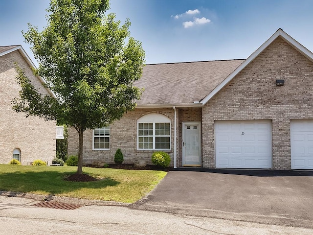 25 Elena Ave Unit 25, Lower Burrell, PA 15068 - view of front of property featuring roof with shingles, brick siding, a front lawn, and driveway