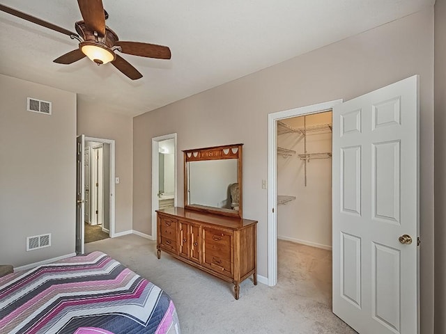 25 Elena Ave Unit 25, Lower Burrell, PA 15068 - bedroom featuring light colored carpet, a walk in closet, a ceiling fan, a closet, and ensuite bathroom