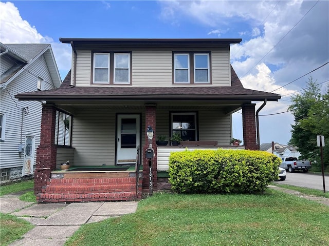 1613 E Washington St, New Castle, PA 16101 - view of front of house with a porch, roof with shingles, and a front lawn