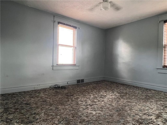 1613 E Washington St, New Castle, PA 16101 - empty room with carpet floors, a textured ceiling, and ceiling fan