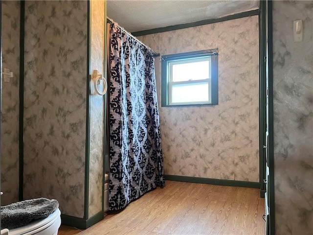 1613 E Washington St, New Castle, PA 16101 - full bath with wood finished floors and a shower with shower curtain