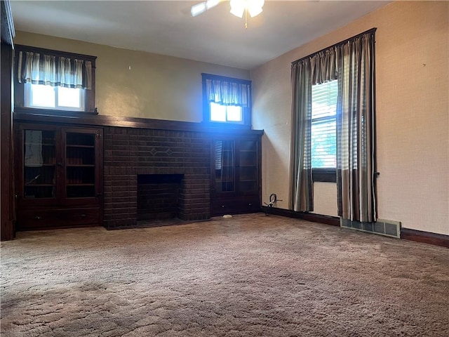 1613 E Washington St, New Castle, PA 16101 - unfurnished living room featuring a fireplace, ceiling fan, and carpet