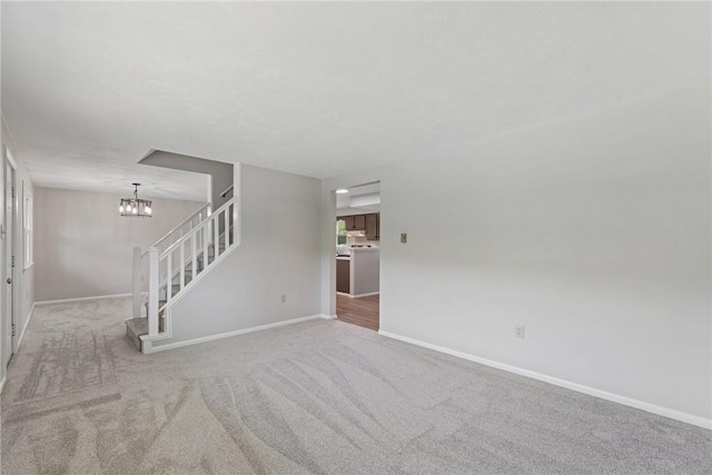359 Meadow Spring Rd, Unity Twp, PA 15650 - unfurnished living room with stairs, a chandelier, and carpet floors