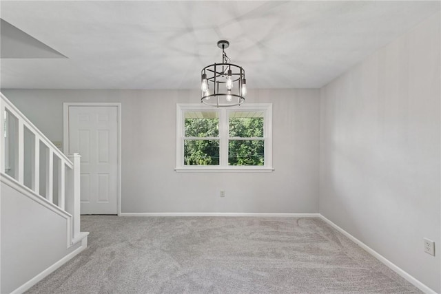 359 Meadow Spring Rd, Unity Twp, PA 15650 - spare room with a chandelier, carpet floors, and stairway