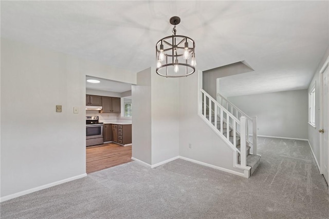 359 Meadow Spring Rd, Unity Twp, PA 15650 - staircase featuring carpet flooring and a chandelier