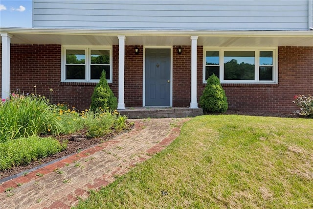 359 Meadow Spring Rd, Unity Twp, PA 15650 - entrance to property featuring a yard, brick siding, and a porch