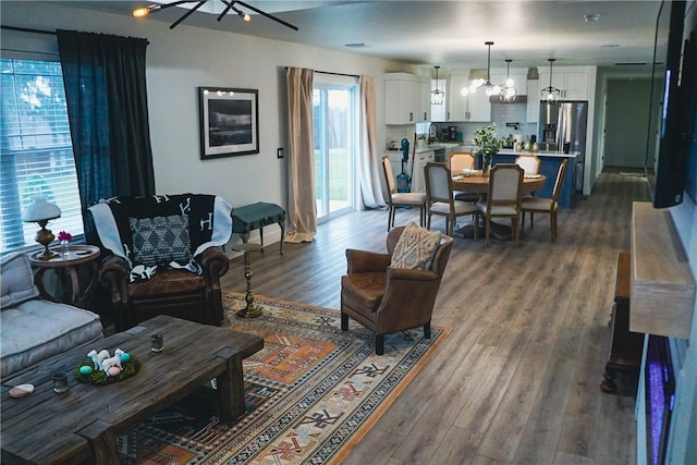 1053 Beaner Hollow Rd, Brighton Twp, PA 15009 - living room featuring a chandelier and dark wood-style flooring