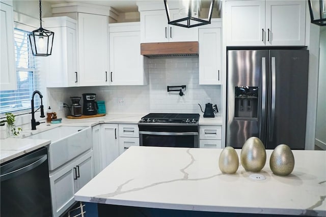 1053 Beaner Hollow Rd, Brighton Twp, PA 15009 - kitchen featuring appliances with stainless steel finishes, exhaust hood, tasteful backsplash, and white cabinets