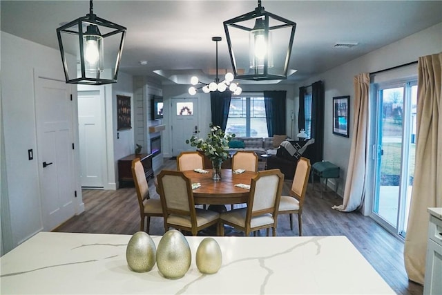 1053 Beaner Hollow Rd, Brighton Twp, PA 15009 - dining room with a chandelier, wood finished floors, and healthy amount of natural light