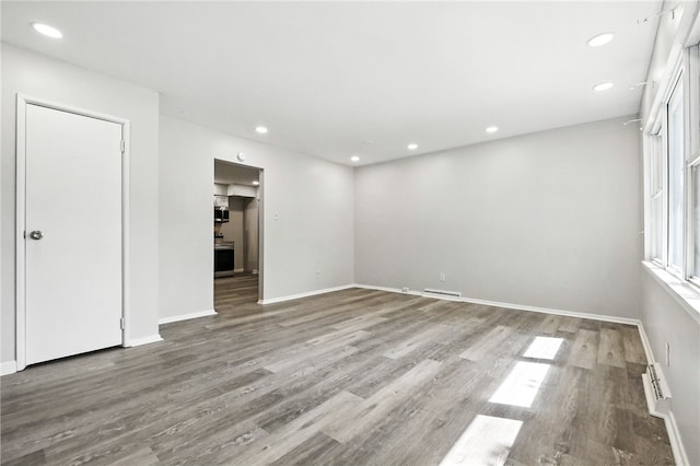 1014 Deerfield Dr, Elizabeth Twp/Boro, PA 15037 - unfurnished room with wood finished floors, recessed lighting, and a baseboard heating unit