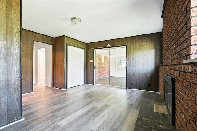1014 Deerfield Dr, Elizabeth Twp/Boro, PA 15037 - unfurnished living room with a fireplace, wood finished floors, and wooden walls
