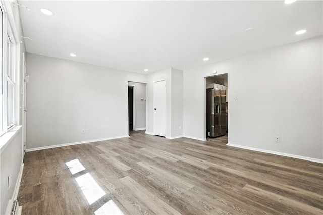 1014 Deerfield Dr, Elizabeth Twp/Boro, PA 15037 - unfurnished room with a baseboard heating unit, wood finished floors, and recessed lighting