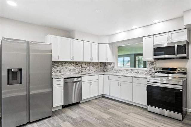 1014 Deerfield Dr, Elizabeth Twp/Boro, PA 15037 - kitchen featuring stainless steel appliances, white cabinetry, light wood finished floors, and recessed lighting
