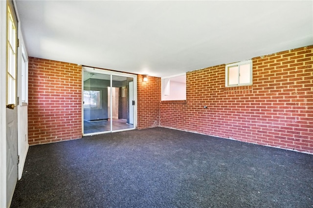 1014 Deerfield Dr, Elizabeth Twp/Boro, PA 15037 - empty room with brick wall and carpet