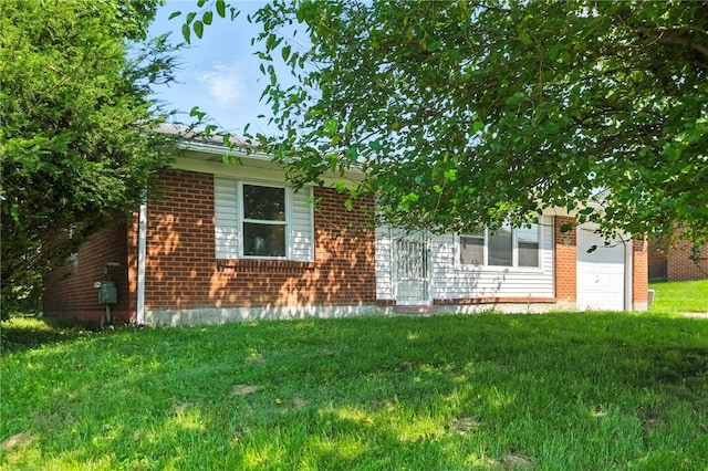 1014 Deerfield Dr, Elizabeth Twp/Boro, PA 15037 - obstructed view of property featuring brick siding, an attached garage, and a front lawn