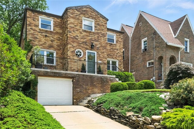 144 Cochran Mt, Lebanon, PA 15228 - view of front of property with brick siding, concrete driveway, and a garage