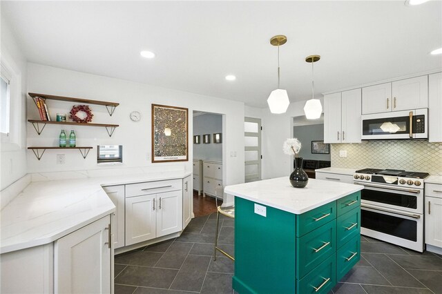 144 Cochran Mt, Lebanon, PA 15228 - kitchen with range with two ovens, dark tile patterned flooring, white cabinetry, and recessed lighting