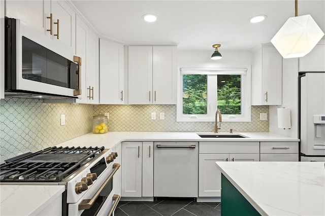 144 Cochran Mt, Lebanon, PA 15228 - kitchen featuring white appliances, white cabinets, tasteful backsplash, light stone counters, and dark tile patterned floors