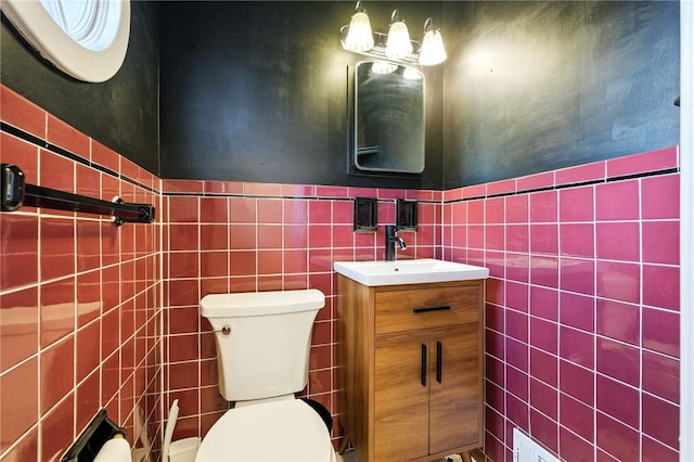 144 Cochran Mt, Lebanon, PA 15228 - half bathroom with tile walls, vanity, and wainscoting