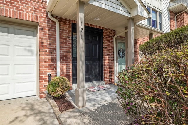 121 Fairway Landings Dr, Cecil, PA 15317 - view of exterior entry featuring brick siding and an attached garage