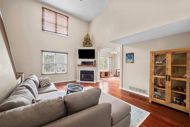 121 Fairway Landings Dr, Cecil, PA 15317 - living room with a high ceiling, a fireplace with flush hearth, and wood finished floors