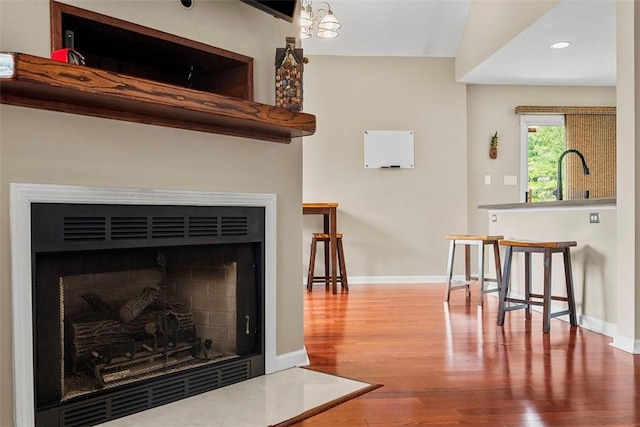 121 Fairway Landings Dr, Cecil, PA 15317 - detailed view of a fireplace with flush hearth, wood finished floors, and recessed lighting