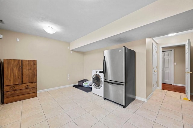 121 Fairway Landings Dr, Cecil, PA 15317 - kitchen featuring freestanding refrigerator, washer / clothes dryer, and light tile patterned floors