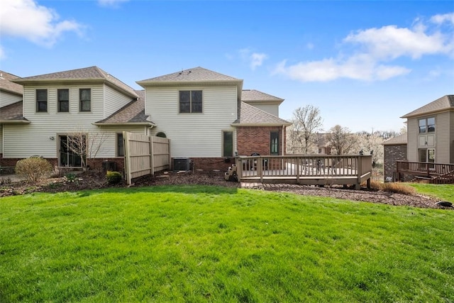 121 Fairway Landings Dr, Cecil, PA 15317 - rear view of property featuring brick siding, a deck, a yard, and roof with shingles